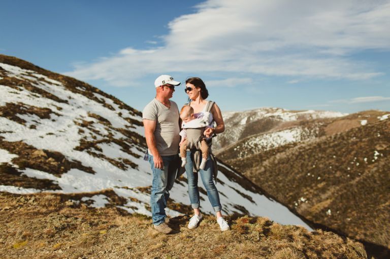 baby wearing lifestyle family portrait session snowy mountains
