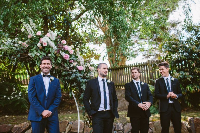 groomsmen waiting for bride